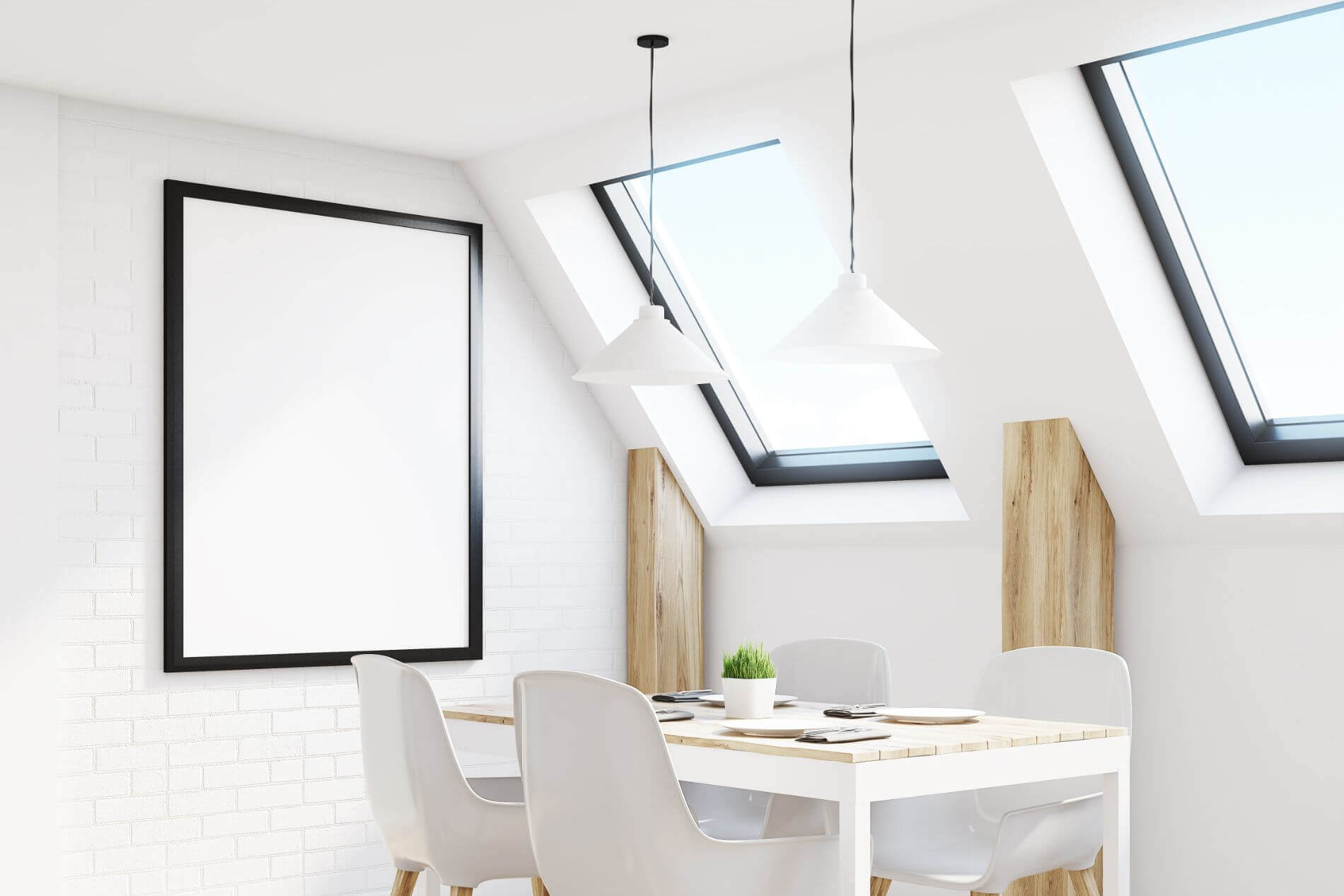 A small dining table in a loft conversion underneath windows.