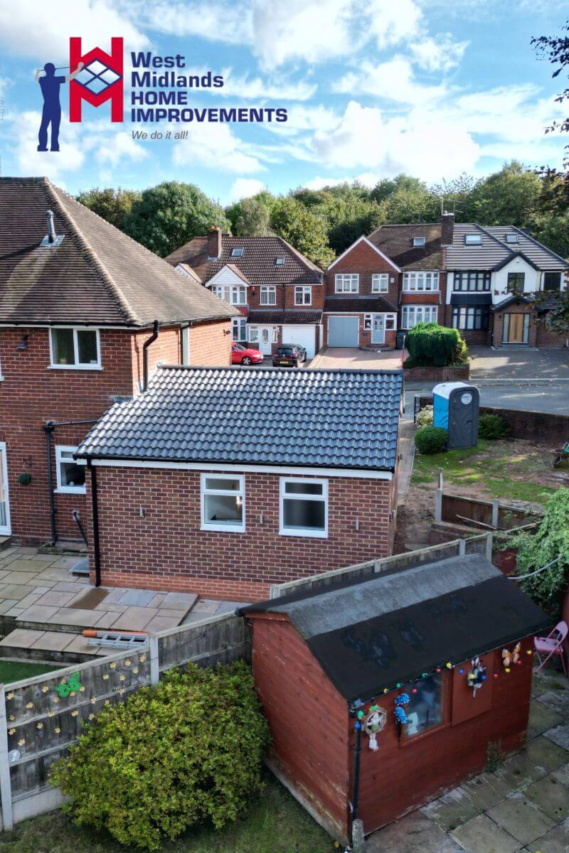Single storey rear extension with a tiled pitched roof and matching brickwork, seamlessly added to a semi-detached home in the West Midlands.