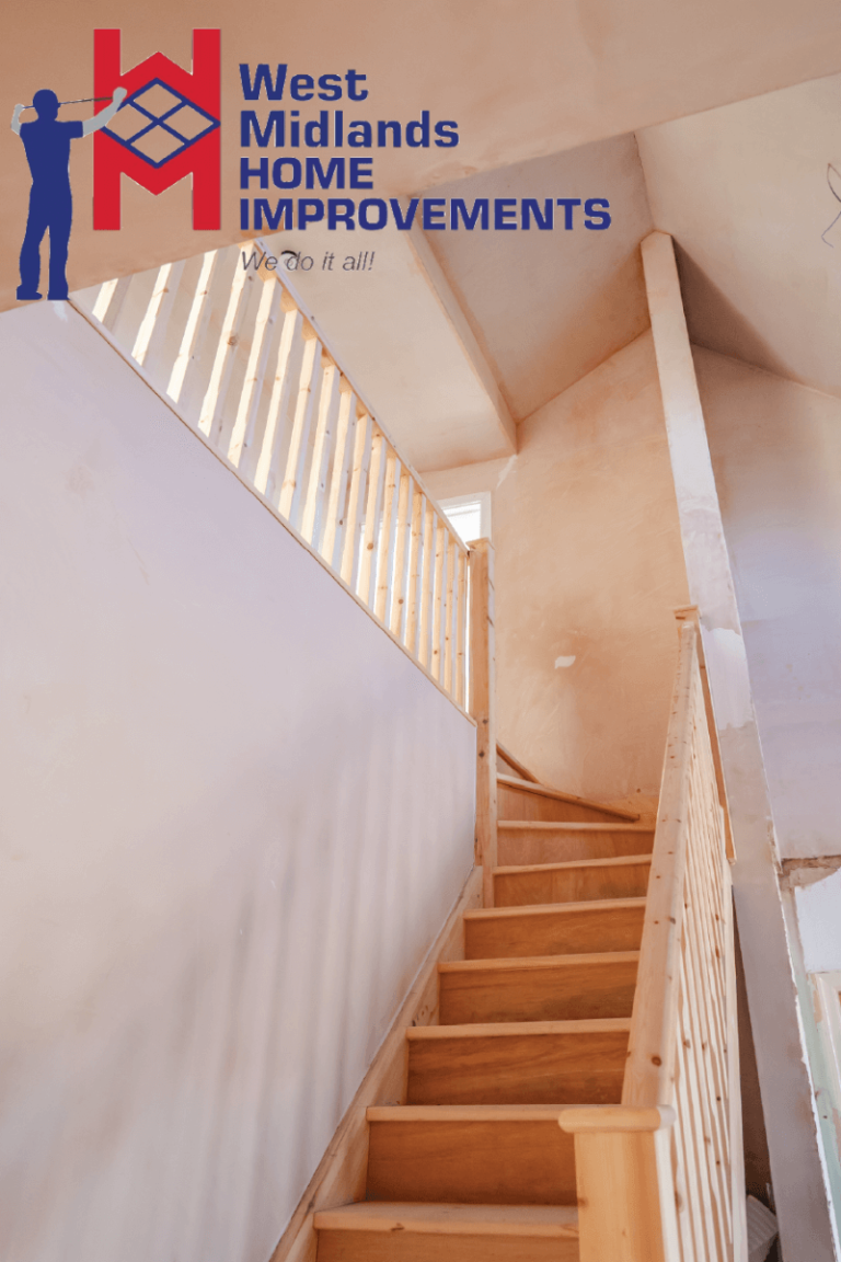 Wooden staircase leading to a loft conversion, with freshly plastered walls ready for finishing.