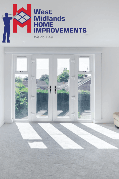 Sunlit room with white-framed French doors and side windows opening out to a garden view.